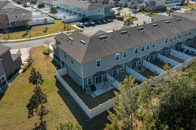 an aerial view of a house with a swimming pool