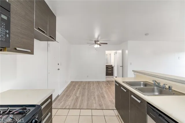 a kitchen with a sink cabinets and appliances
