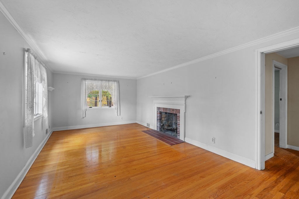 10 Standish Way Lynn, MA 01904 - Photo 16 of 41 a view of empty room with wooden floor and fan