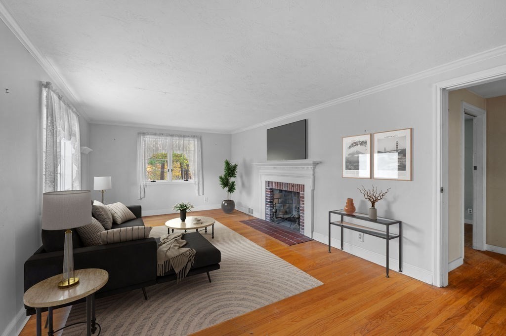 10 Standish Way Lynn, MA 01904 - Photo 17 of 41 a living room with furniture and a fireplace