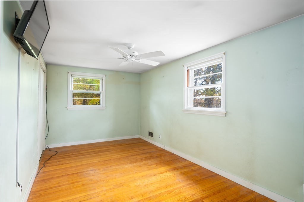 10 Standish Way Lynn, MA 01904 - Photo 20 of 41 a view of a room with a wooden floor and a window