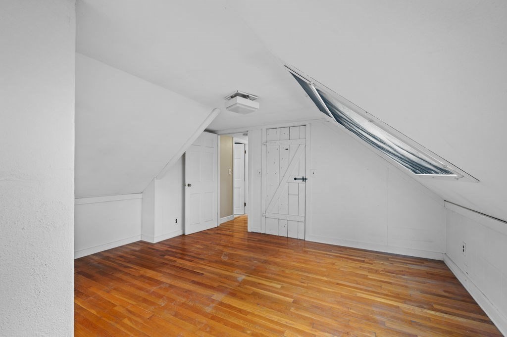 10 Standish Way Lynn, MA 01904 - Photo 27 of 41 a view of a big room with wooden floor and stairs