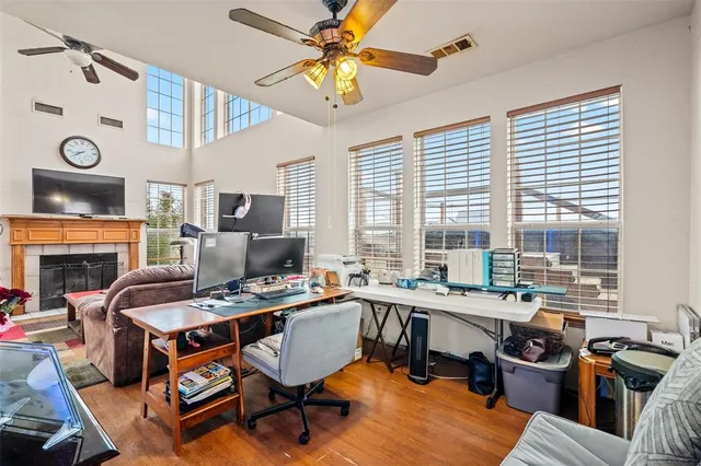 a room with stainless steel appliances a stove a table chair and a window