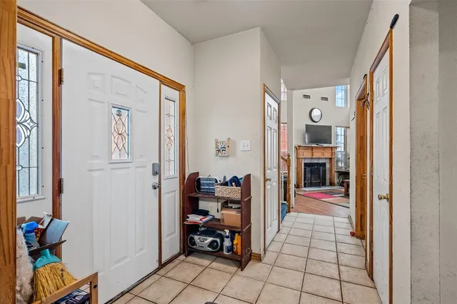 a hall way with closet and a couch