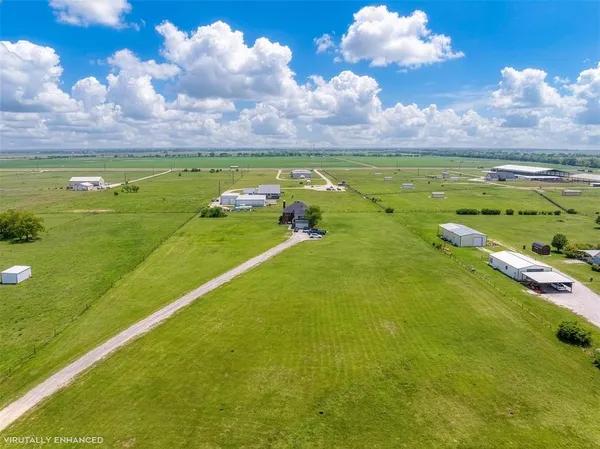 a view of an ocean and a houses