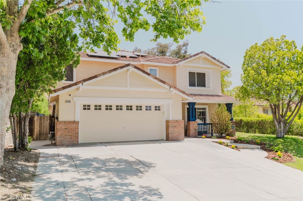 32480 The Old Road Castaic, CA 91384 - Photo 66 of 68 a view of a white house with a yard and large tree
