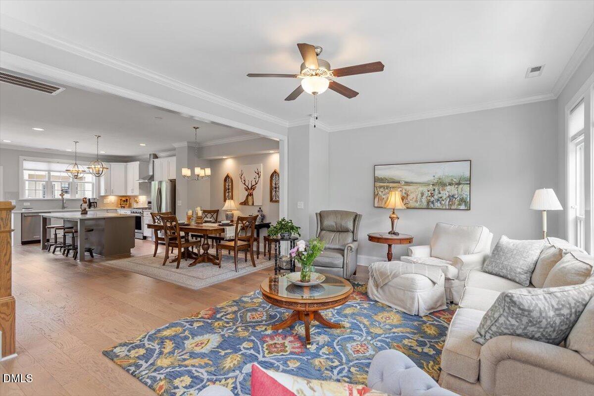 1601 Bowery Drive Raleigh, NC 27607 - Photo 11 of 41 a living room with furniture and view of kitchen