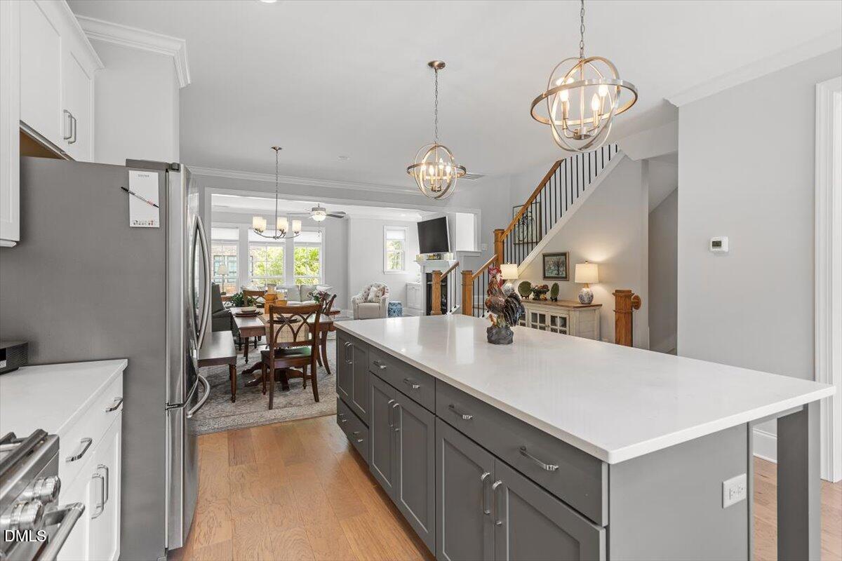 1601 Bowery Drive Raleigh, NC 27607 - Photo 17 of 41 a large kitchen with a table and chairs