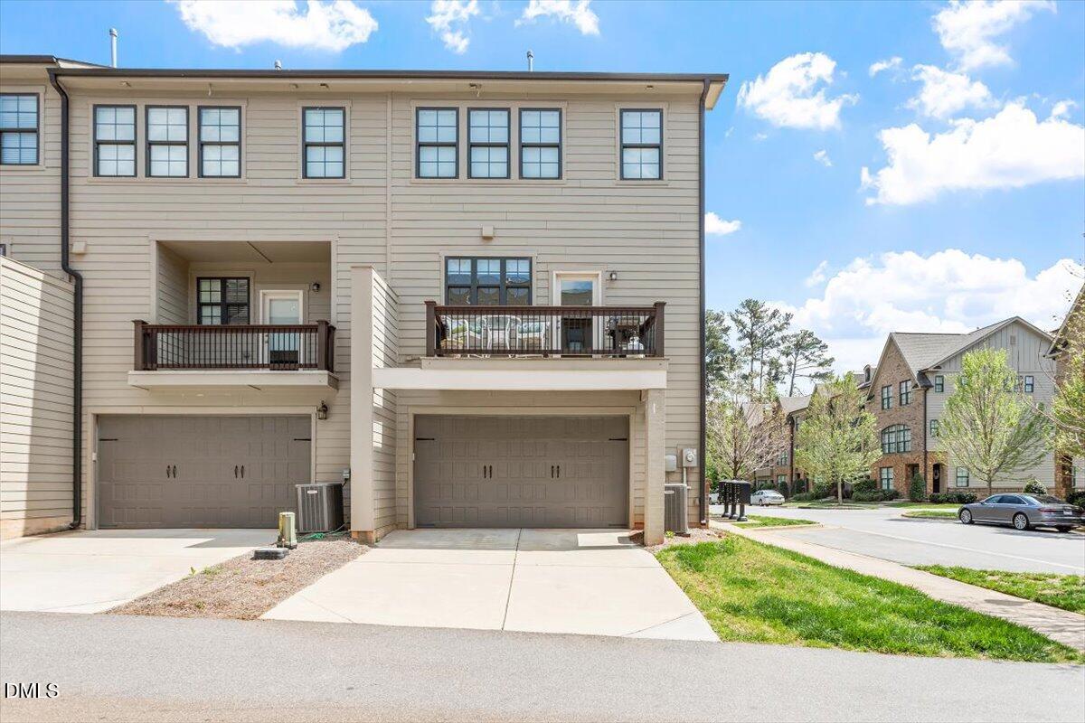 1601 Bowery Drive Raleigh, NC 27607 - Photo 22 of 41 a front view of a house with a yard and garage