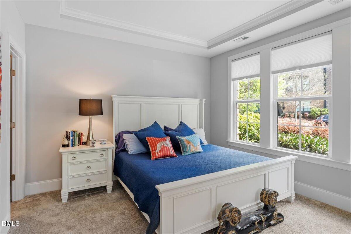 1601 Bowery Drive Raleigh, NC 27607 - Photo 5 of 41 a bedroom with a bed and a window