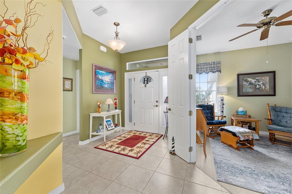 16339 Southwest 14th Avenue Road Ocala, FL 34473 - Photo 7 of 22 a living room with furniture and a table