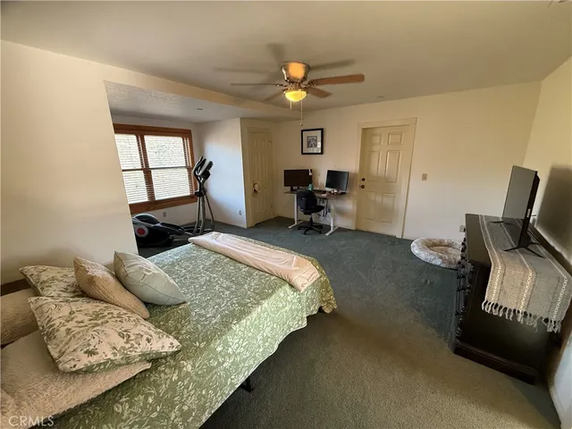 a bathroom with a sink toilet and window