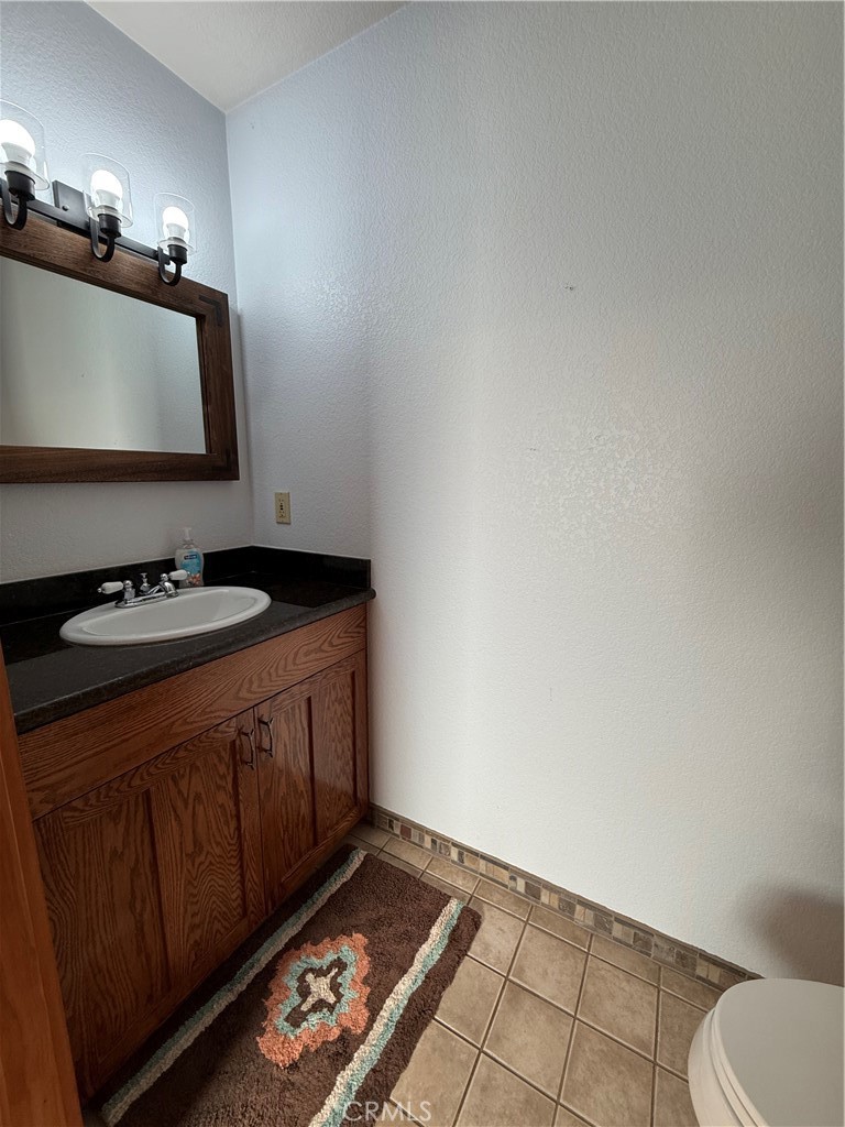 28147 North Lake Wohlford Road Valley Center, CA 92082 - Photo 16 of 26 a bathroom with a sink and a mirror