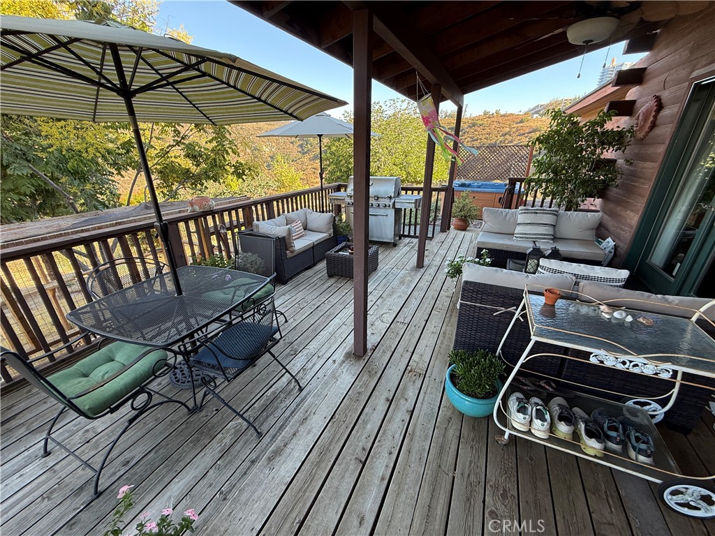 28147 North Lake Wohlford Road Valley Center, CA 92082 - Photo 18 of 26 a view of a balcony with furniture and wooden floor