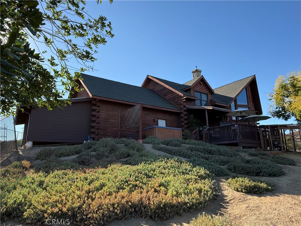 28147 North Lake Wohlford Road Valley Center, CA 92082 - Photo 21 of 26 a front view of a house with garden