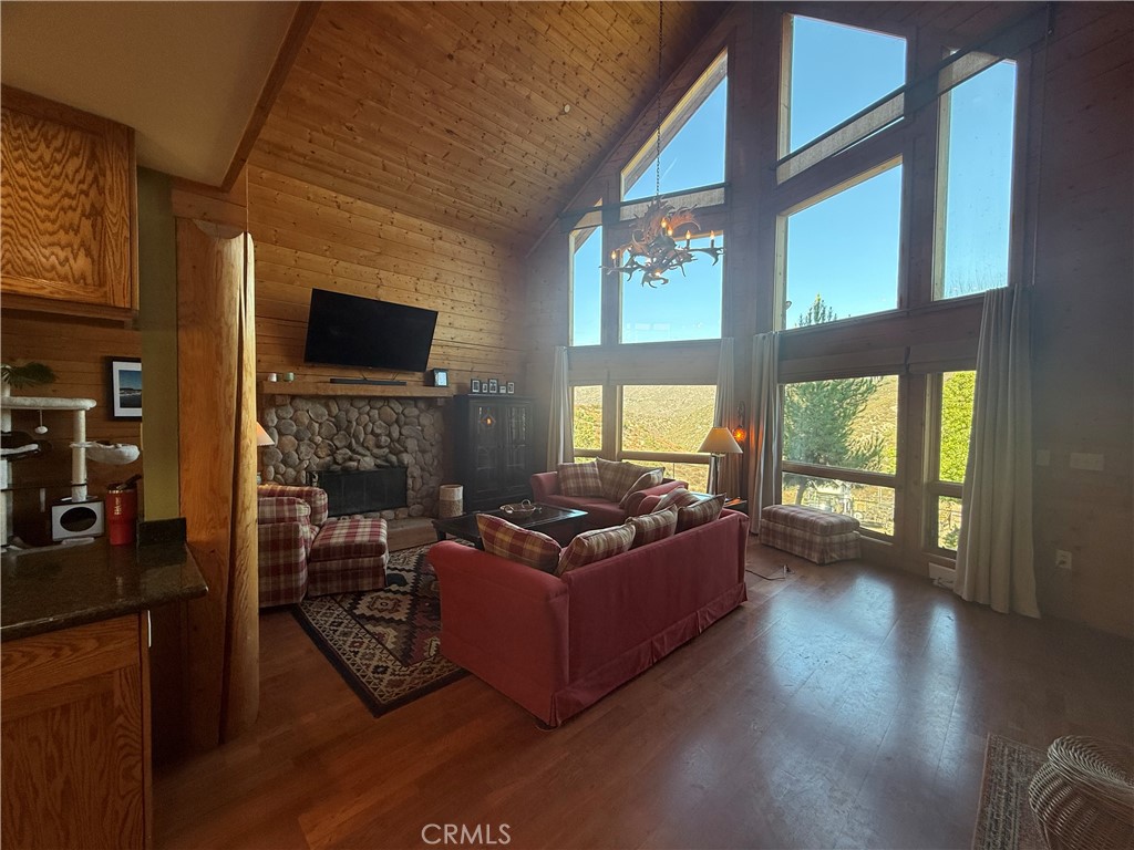 28147 North Lake Wohlford Road Valley Center, CA 92082 - Photo 6 of 26 a living room with furniture and a flat screen tv