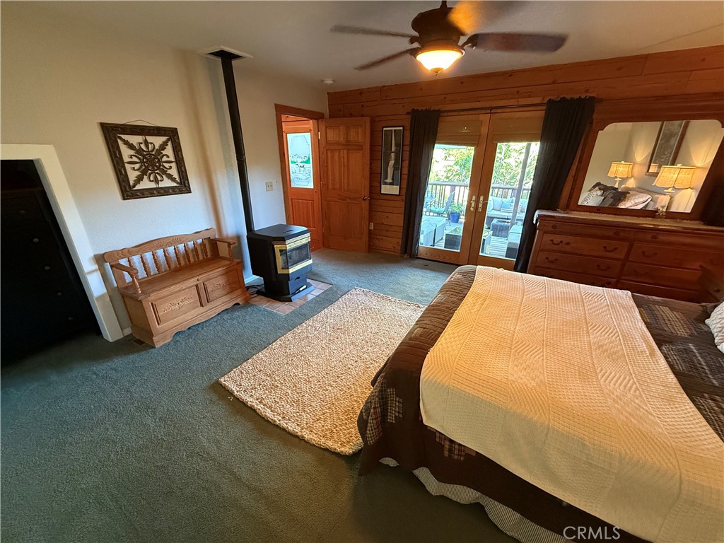 28147 North Lake Wohlford Road Valley Center, CA 92082 - Photo 9 of 26 a bed room with a bed tv and a large window