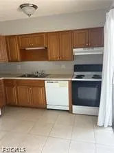 a kitchen with a stove and a sink