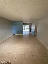 a view of a livingroom and window