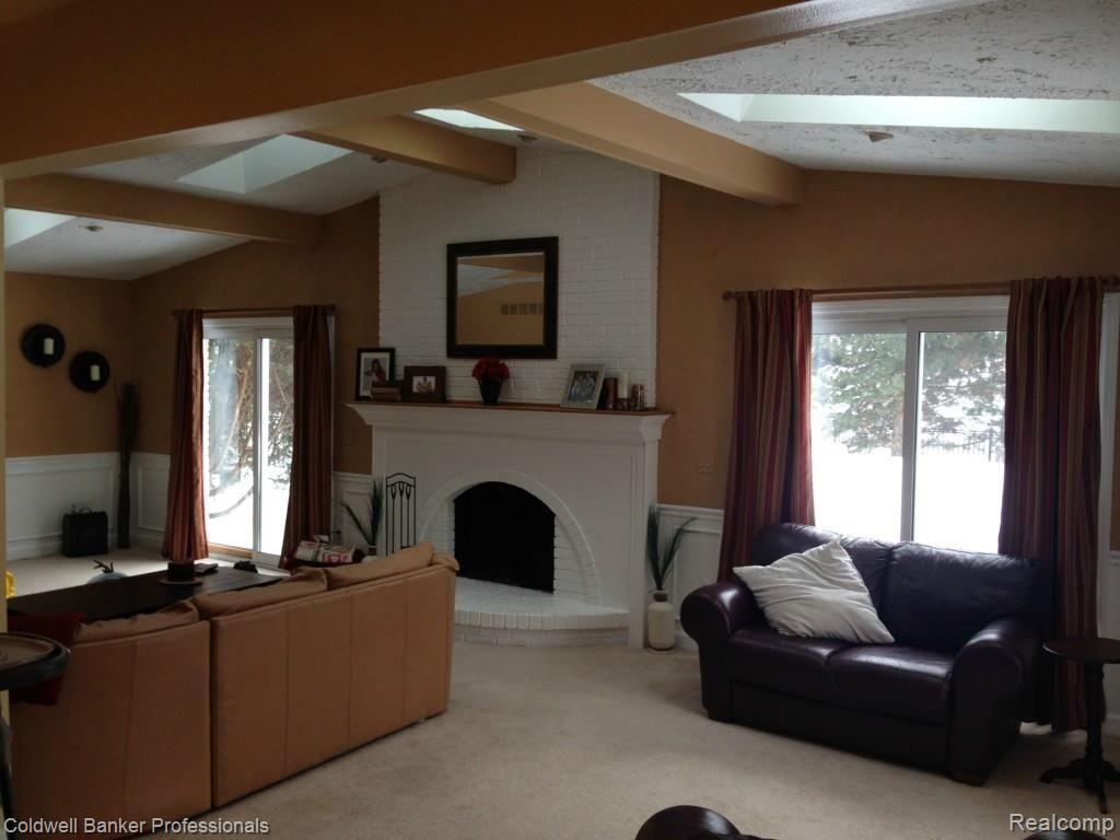 1551 Crooks Road Rochester, MI 48309 - Photo 18 of 33 Family Room with Natural Fireplace and Door Walls