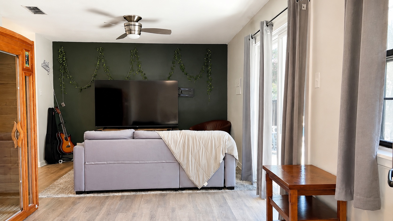 6016 Signal Point Austin, TX 78724 - Photo 2 of 20 Laminate flooring and a ceiling fan create a comfortable atmosphere in this inviting living space.