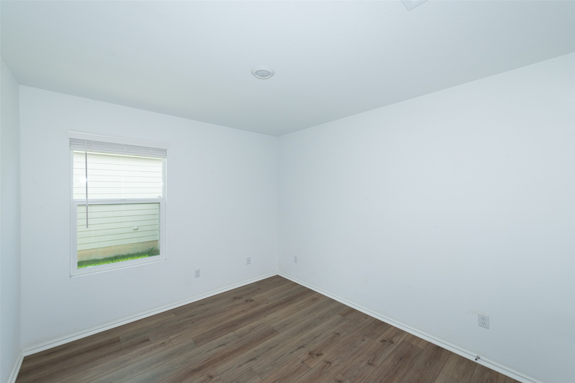 147 Otter Road Kyle, TX 78640 - Photo 6 of 34 Bedroom #3 facing left of the property full closet