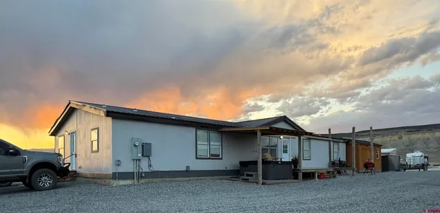 a view of a car park in front of house