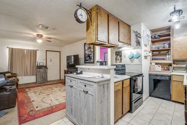 a kitchen with a stove and a refrigerator