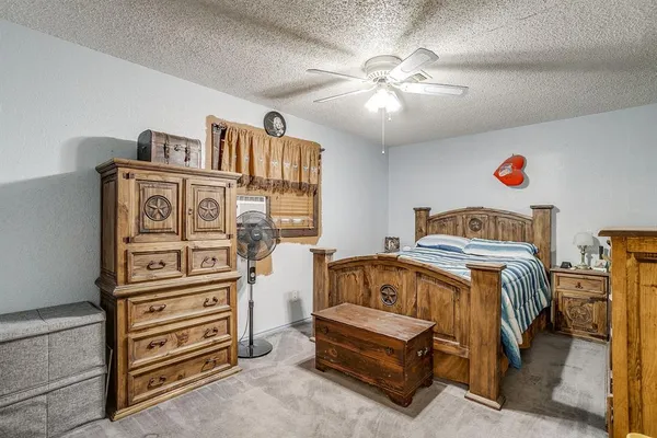 a bedroom with a bed and cabinets