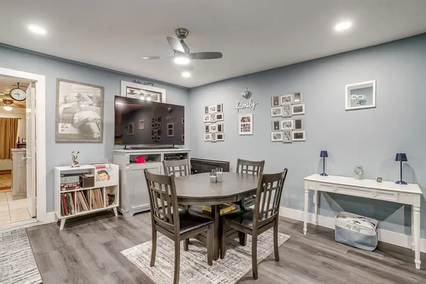 a view of a dining room with furniture and wooden floor