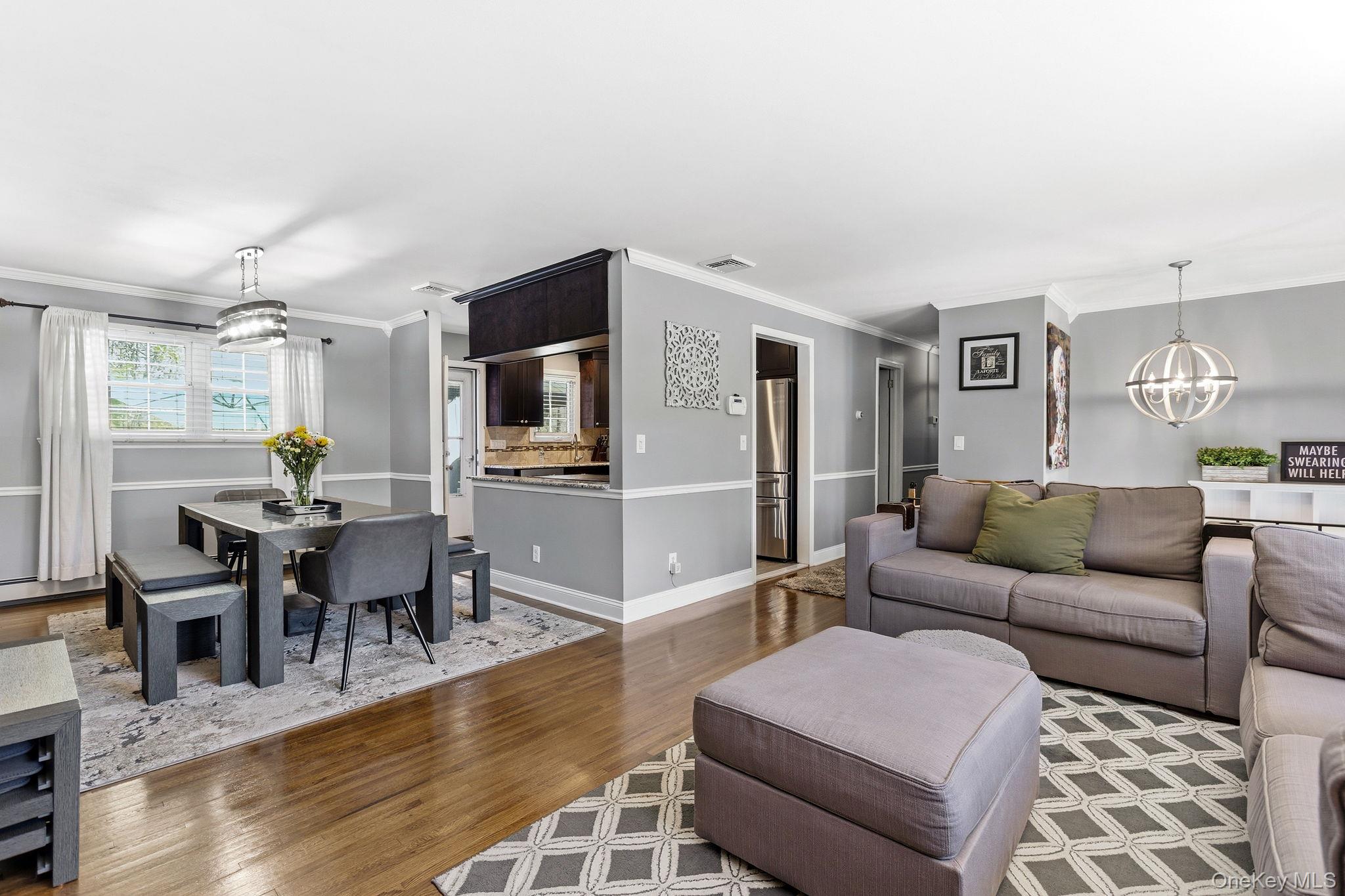 56 Tanager Road Mahopac, NY 10541 - Photo 5 of 30 a living room with furniture dining table and a flat screen tv