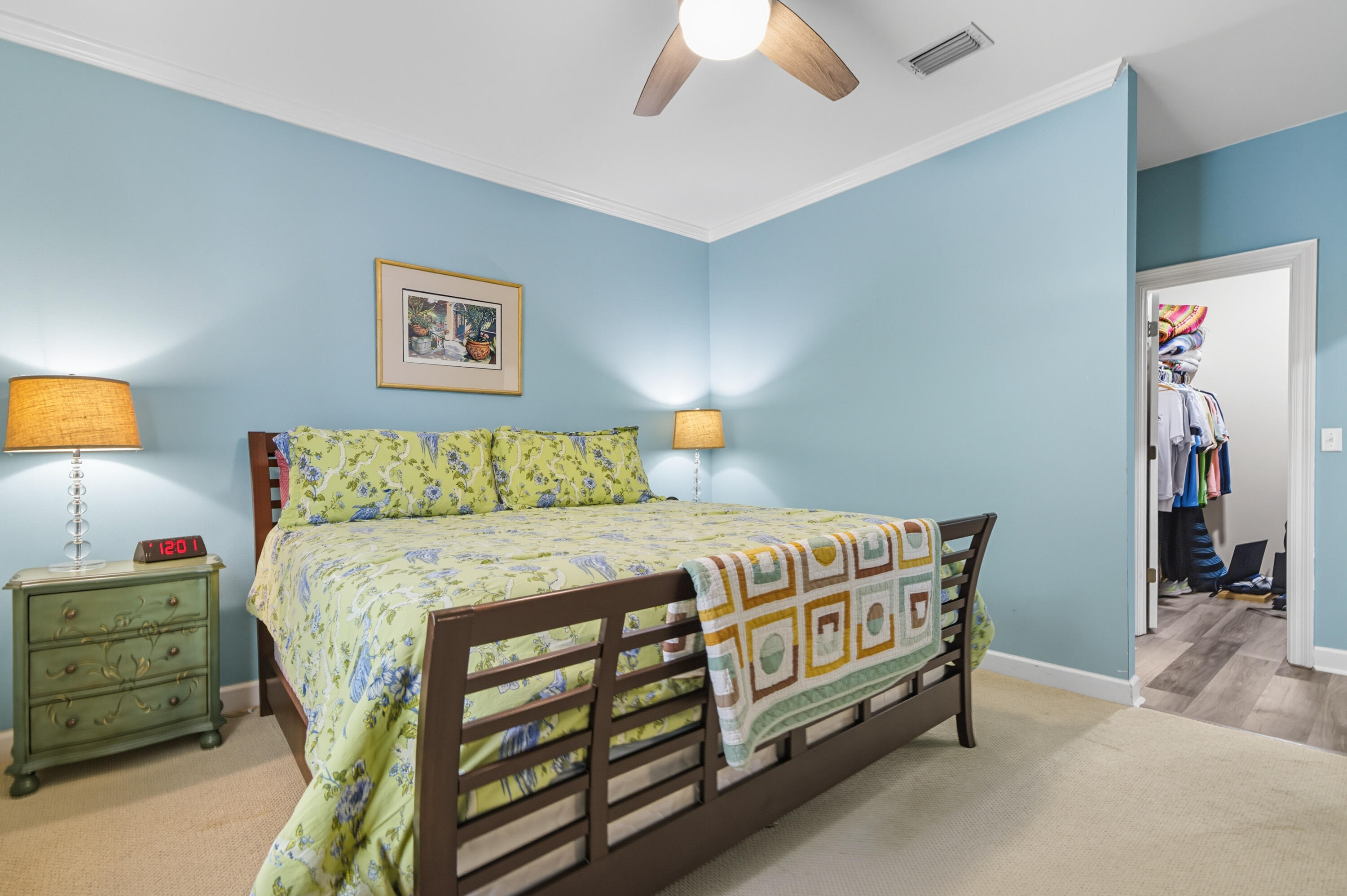 8 Corte Palma, Unit 61A Santa Rosa Beach, FL 32459 - Photo 12 of 32 a bedroom with a bed a lamp and a chandelier