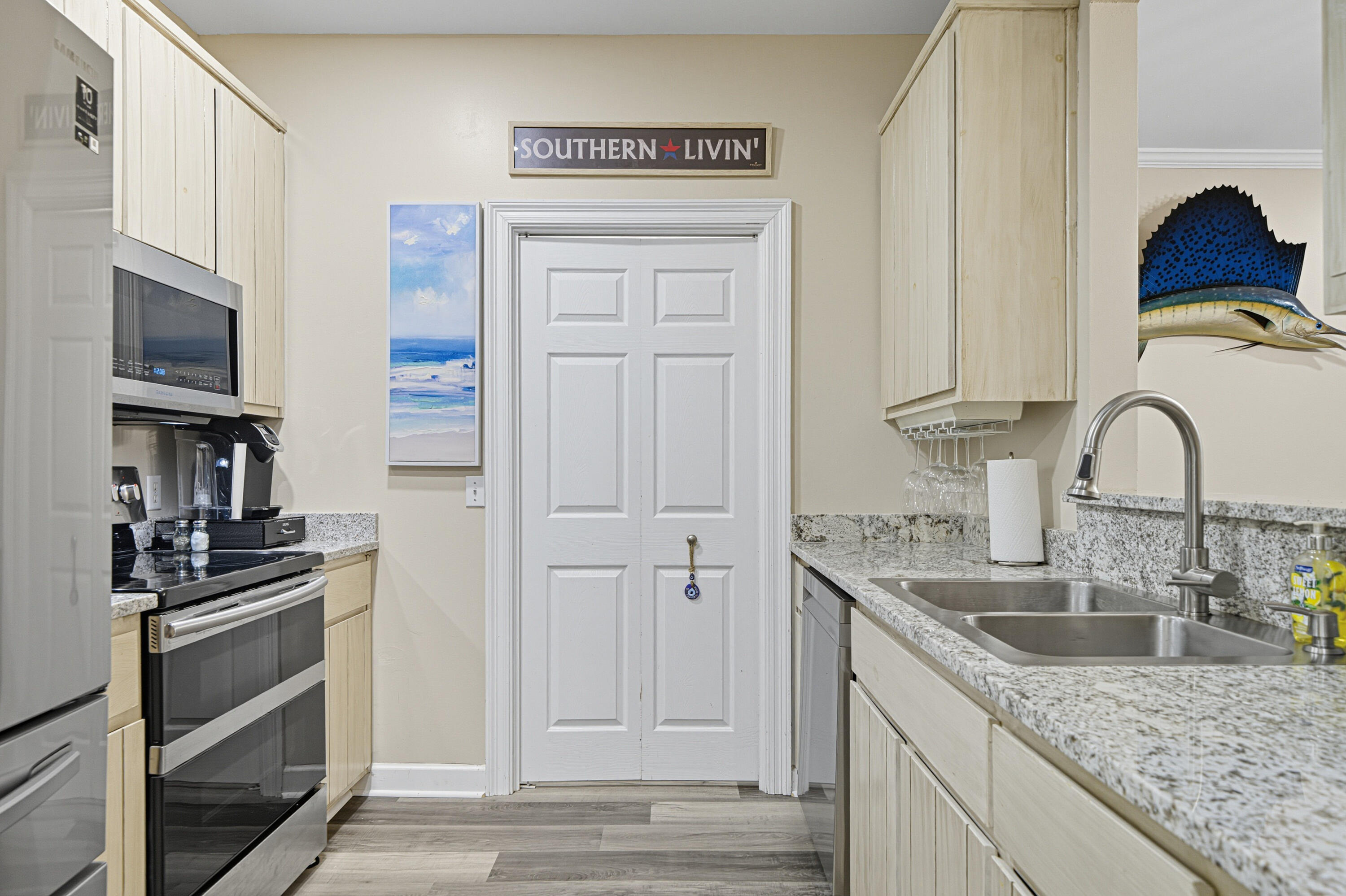 8 Corte Palma, Unit 61A Santa Rosa Beach, FL 32459 - Photo 8 of 32 a kitchen with granite countertop a stove and a sink