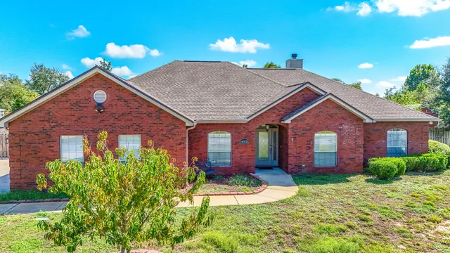 a front view of a house with yard