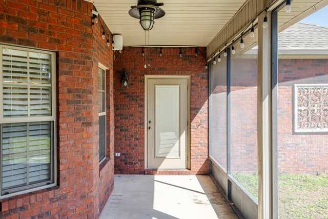 a view of a hallway with a glass door