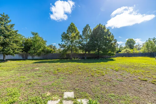a backyard of a house with lots of green space