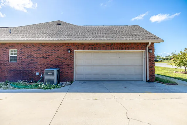 an aerial view of residential houses with outdoor space and swimming pool