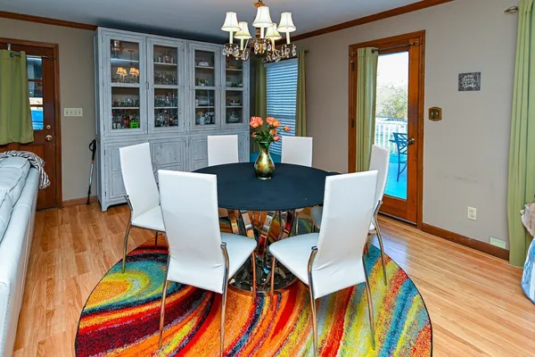 a view of a dining room with furniture and a potted plant