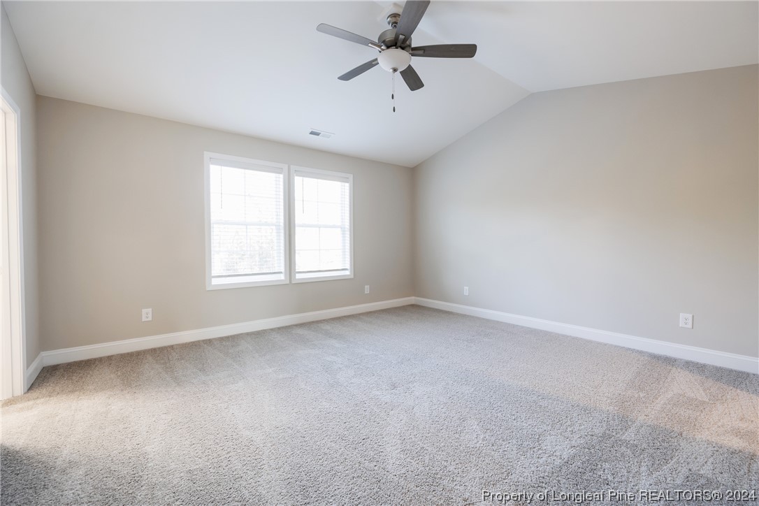 908 Westland Ridge Road Fayetteville, NC 28311 - Photo 14 of 28 an empty room with a window and a fan