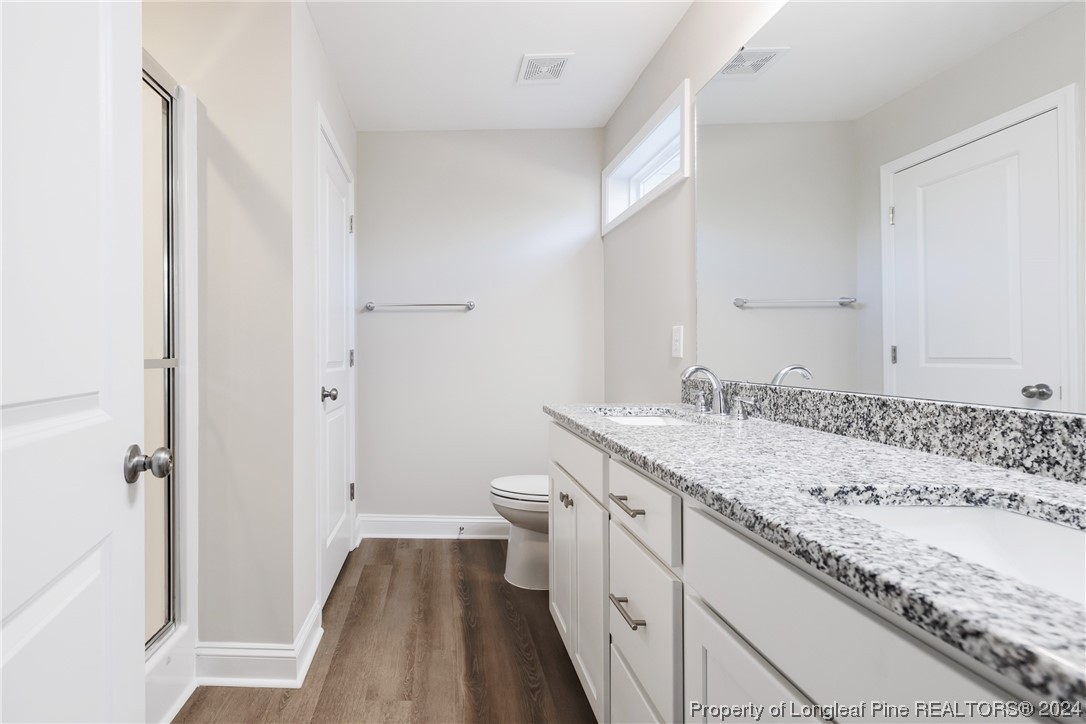 908 Westland Ridge Road Fayetteville, NC 28311 - Photo 17 of 28 a bathroom with a granite countertop sink and a mirror
