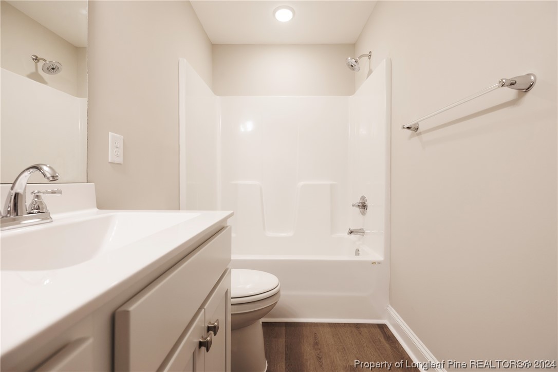 908 Westland Ridge Road Fayetteville, NC 28311 - Photo 25 of 28 a bathroom with a sink a toilet and shower