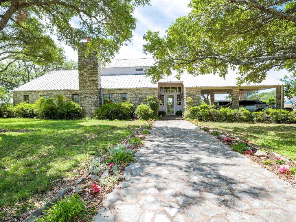 555 Field Road Fischer, TX 78623 - Photo 1 of 1 a front view of a house with garden