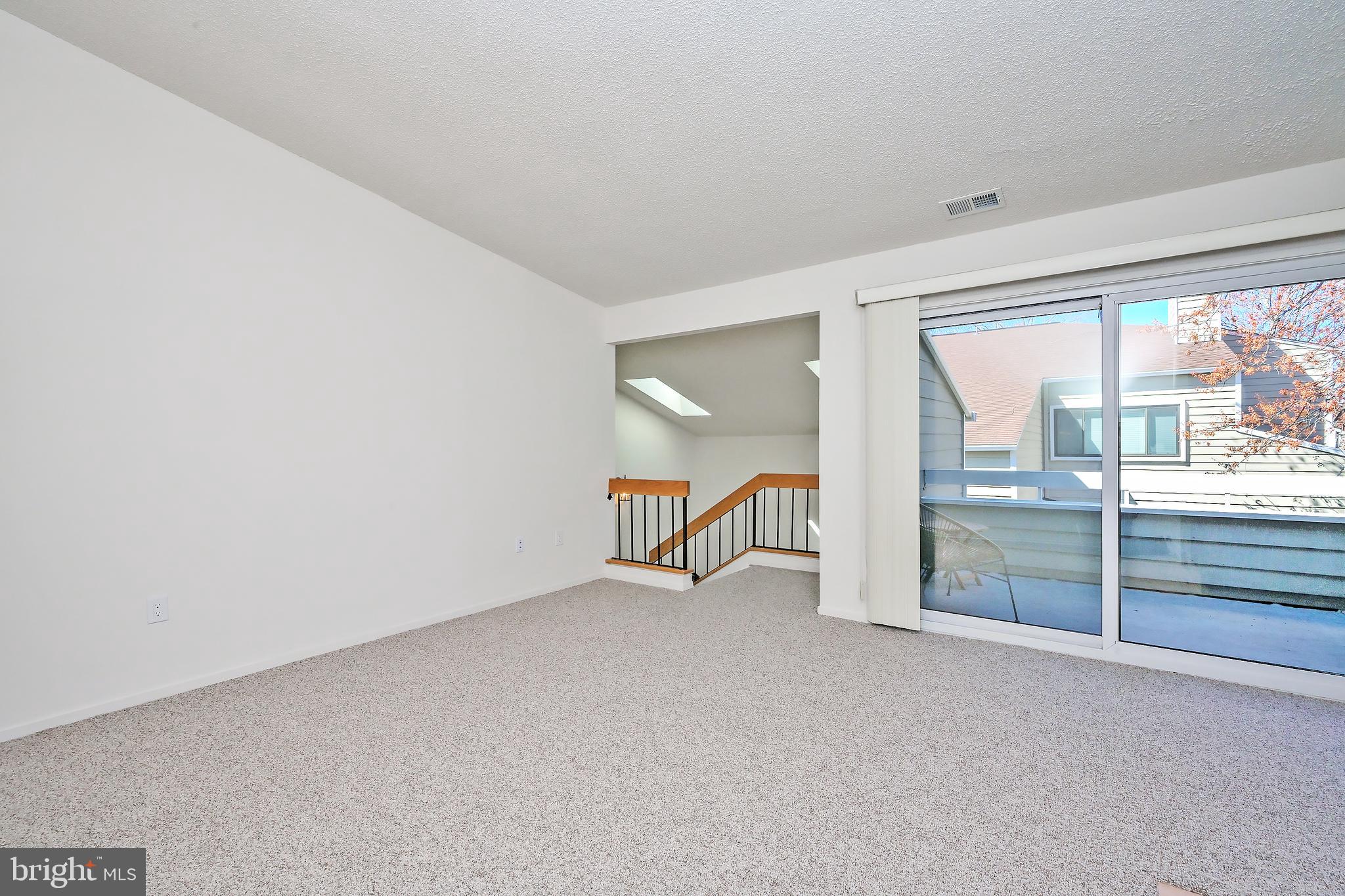 1963 B Villaridge Drive, Unit 1963B Reston, VA 20191 - Photo 20 of 41 Living Room Opens to Balcony