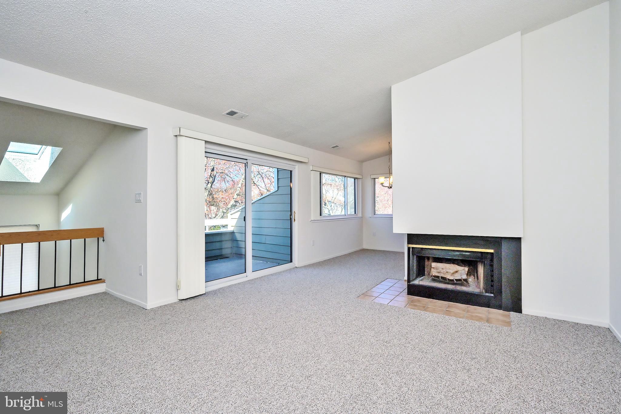 1963 B Villaridge Drive, Unit 1963B Reston, VA 20191 - Photo 4 of 41 Living Room with Wood Burning Fireplace