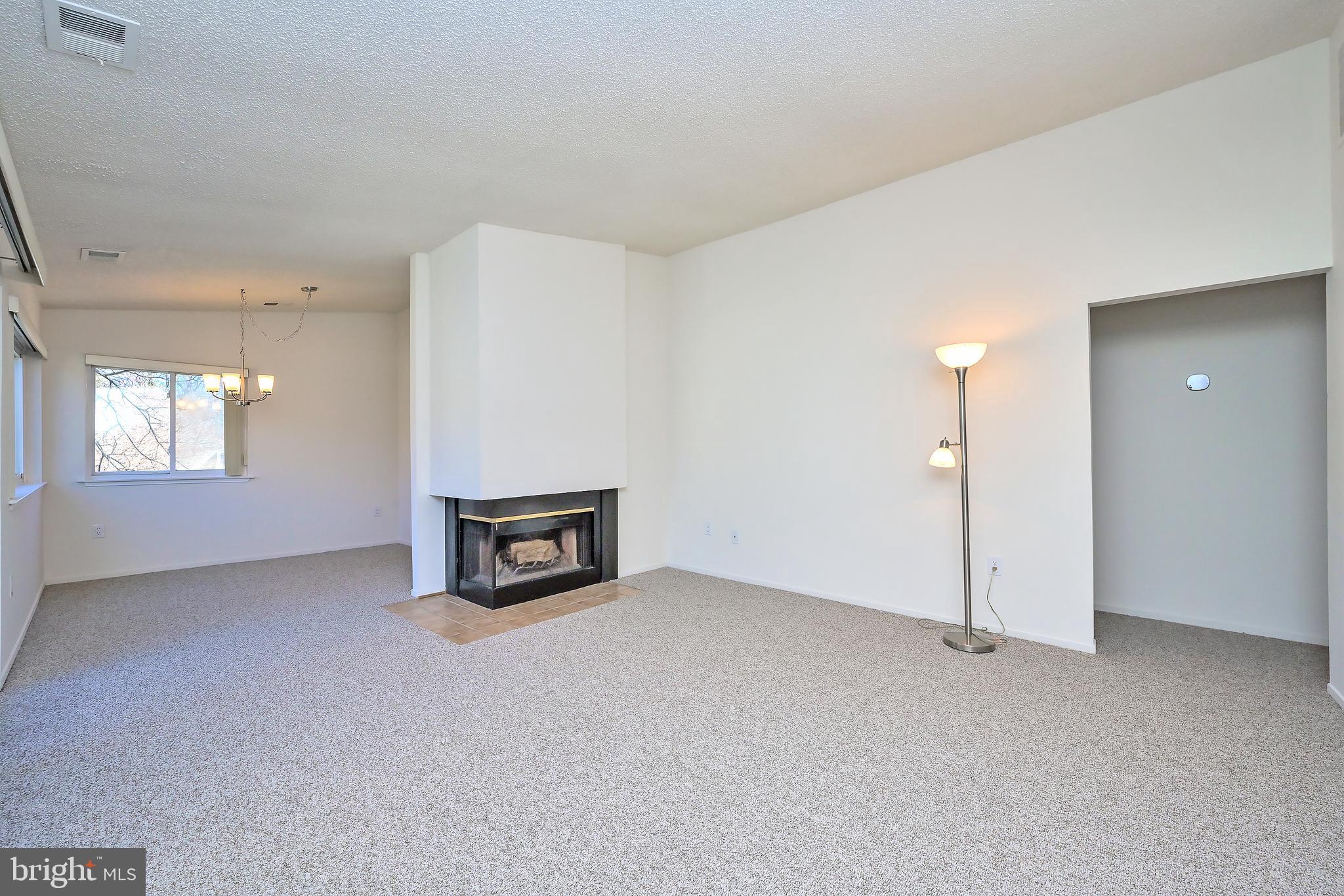 1963 B Villaridge Drive, Unit 1963B Reston, VA 20191 - Photo 5 of 41 Living Room opens to dining room