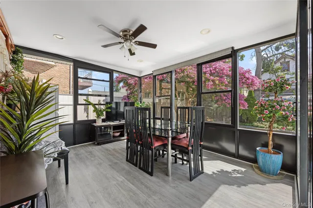 a view of a dining room with furniture window and outside view