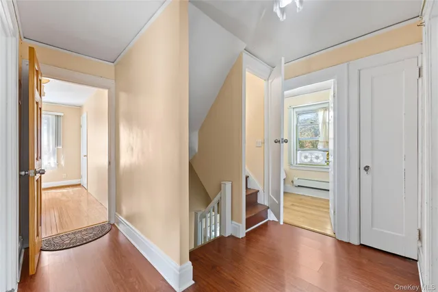 a view of entryway with wooden floor