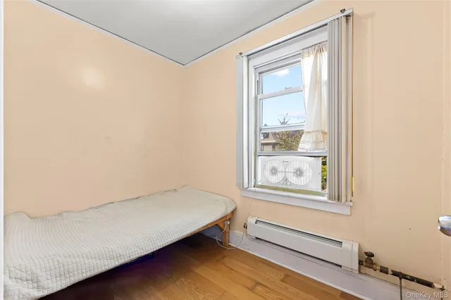 a room with a bed and a window