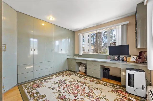 a view of a bathroom with dual sinks
