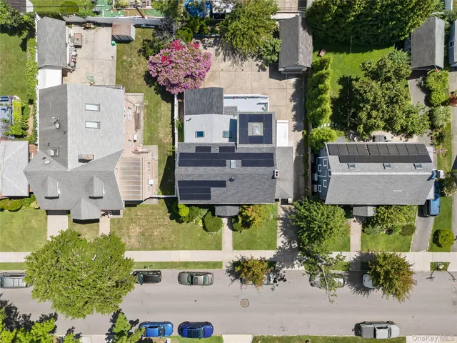 an aerial view of multiple houses with outdoor space
